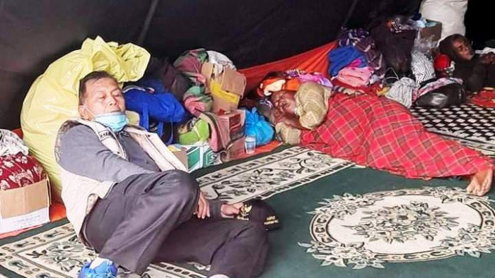 The Regent of West Pasaman sleeps in a refugee tent with a carpet